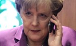 Germany's Angela Merkel using her mobile phone