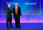 Nokia chief executive Stephen Elop welcomes Microsoft chief executive Steve Ballmer with a handshake at a Nokia event in London